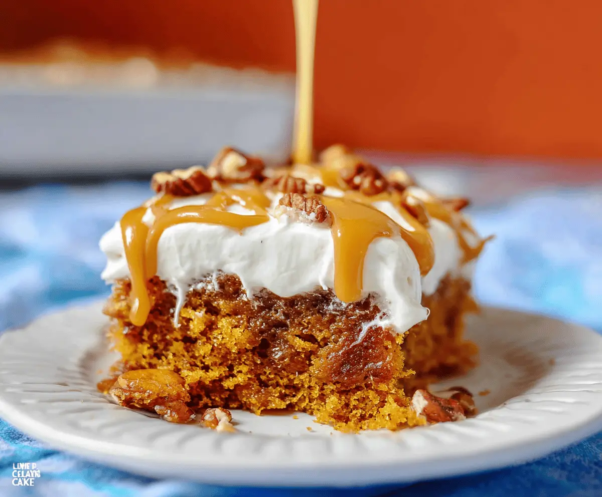 Delicious Pumpkin Poke Cake topped with whipped cream and cinnamon, perfect for fall desserts