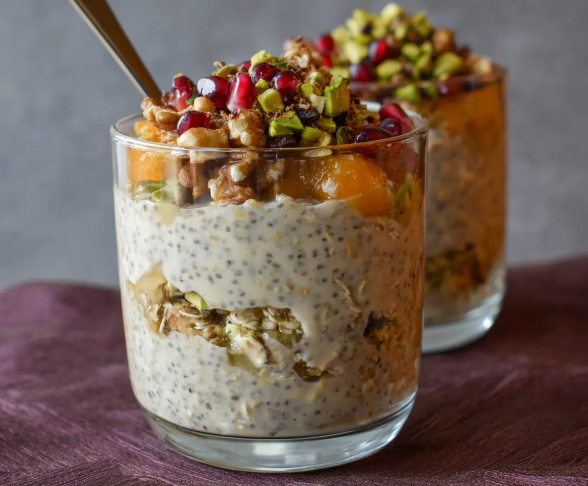 Delicious Baklava Overnight Oats with layers of honey, nuts, and flaky pastry topped with cinnamon.