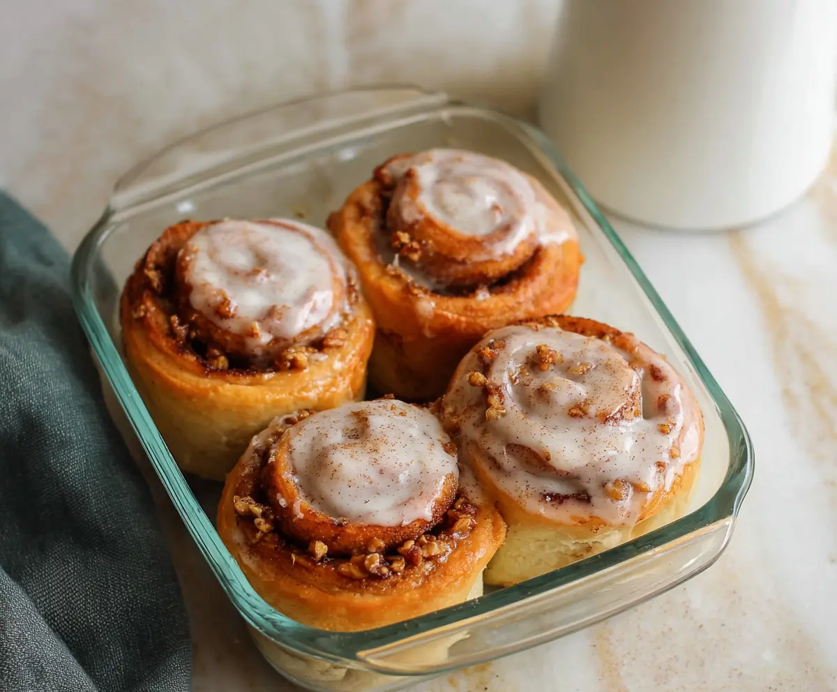 Delicious cottage cheese cinnamon rolls fresh out of the oven, showcasing swirls of cinnamon and creamy cheese filling.