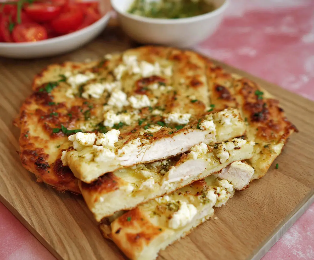 Delicious homemade cottage cheese flatbread served with fresh herbs and olive oil.