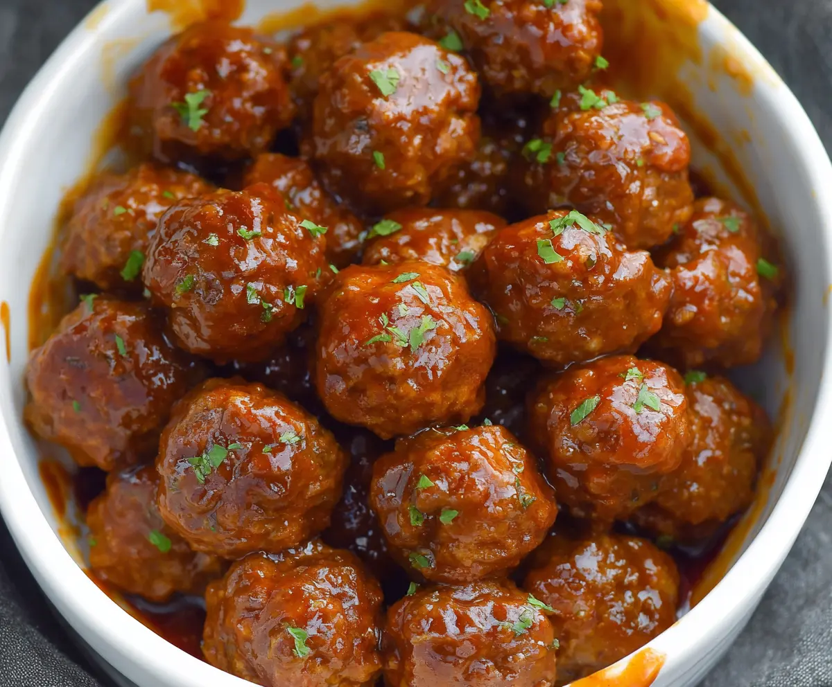 Delicious slow cooker honey buffalo meatballs glazed in spicy and sweet sauce.