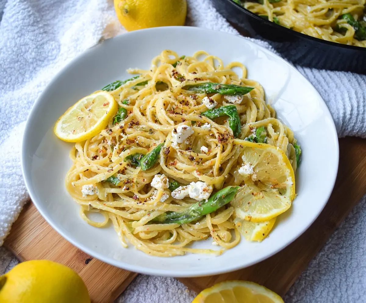 Creamy Lemon Feta Pasta with fresh herbs in a rustic bowl